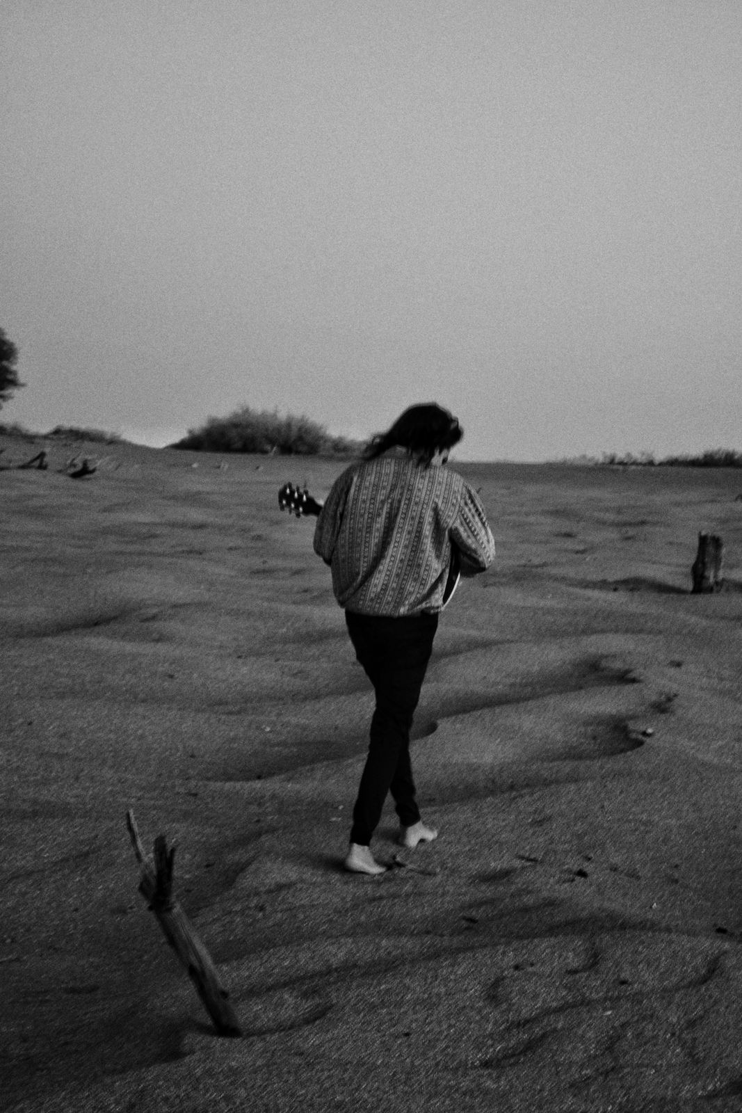 Guitar, sand